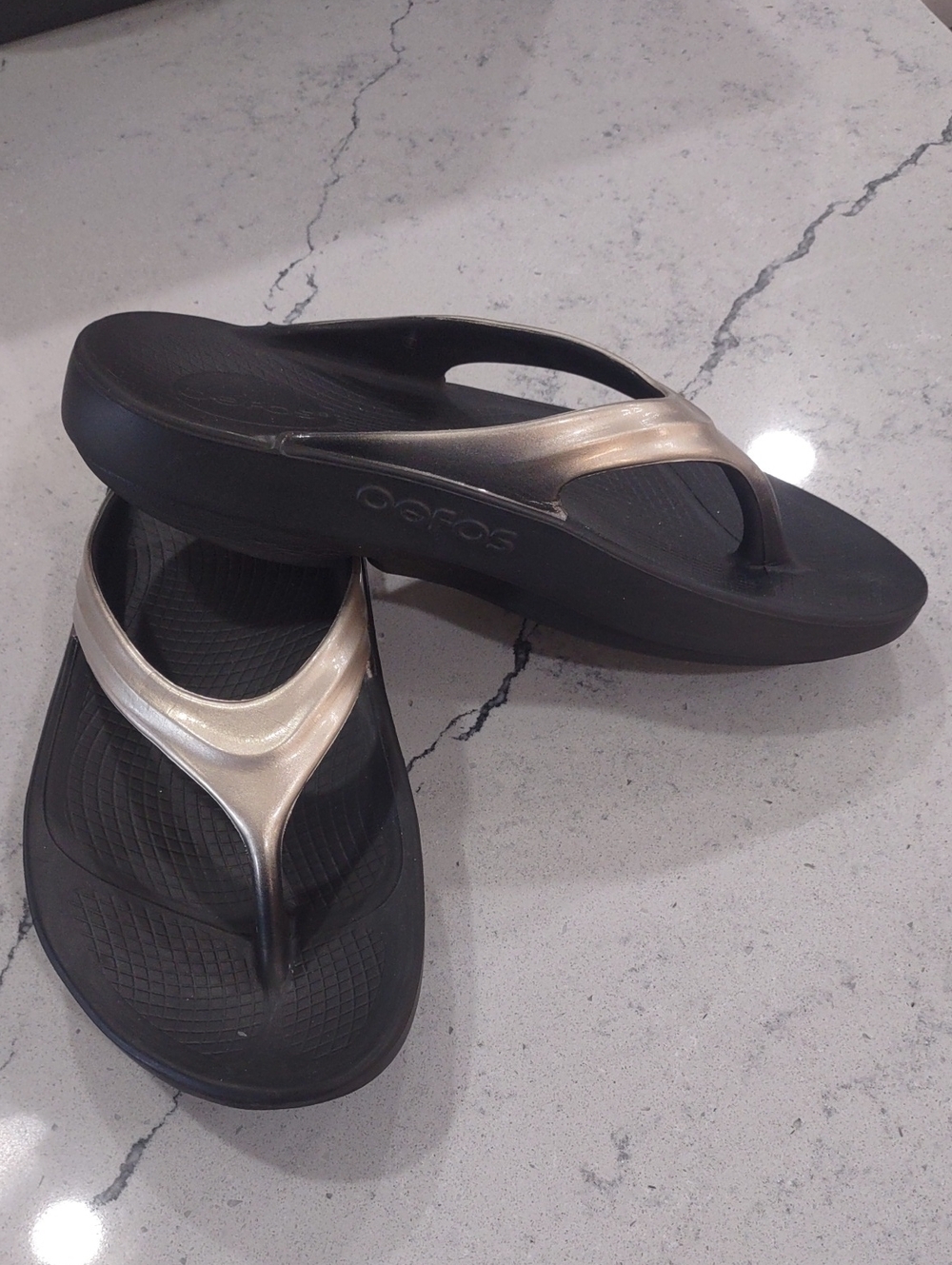 OOFOS Black Sandals with Metallic Gold Straps Size 7